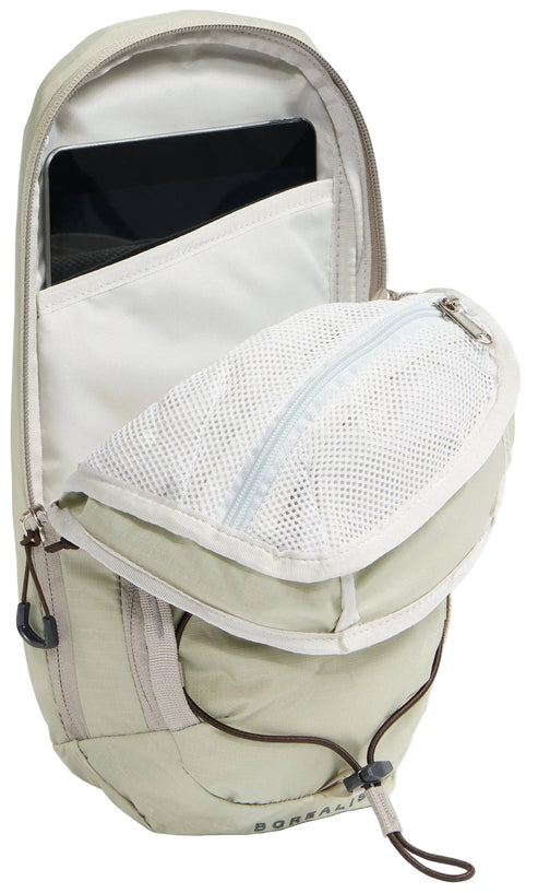 A light beige backpack with a partially opened front zippered compartment displaying an interior mesh pocket and a tablet stored in the main compartment, featuring a bungee cord system on the lower exterior.
