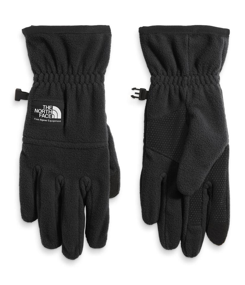 Two black fleece gloves with grip dots on the palm. The North Face logo on one glove.