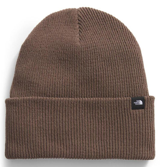 Dark brown knit beanie with folded brim and small logo.