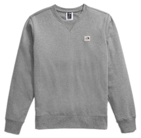 Gray crew neck sweatshirt with logo on the chest and tag on the collar.