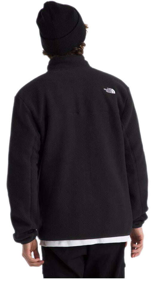 Black fleece jacket, mock neck, long sleeves, and logo on upper right shoulder. Black beanie.