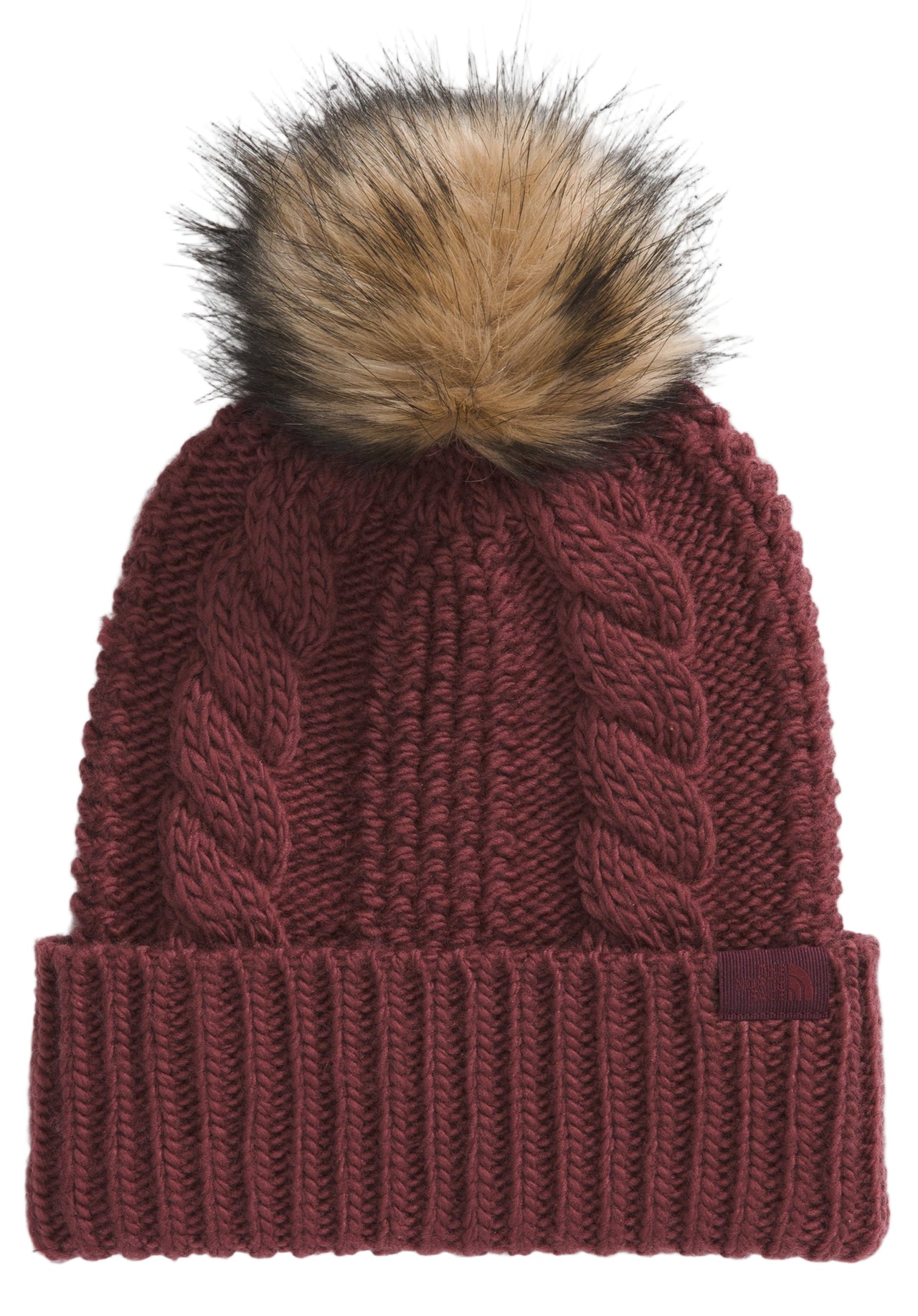 Maroon knit beanie with cable-knit design and faux-fur pompom.