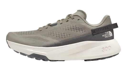 A gray athletic shoe with white sole, showing 'NORTH FACE' text on the heel.