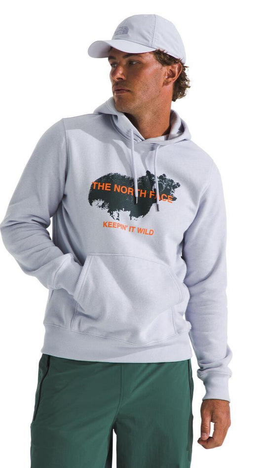 Person wearing light gray hooded sweatshirt with "THE NORTH FACE, KEEP IT WILD" and an animal print on the front.