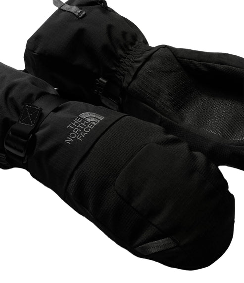 A pair of black, insulated winter mittens with adjustable wrist straps, featuring "THE NORTH FACE" logo printed on the back of the hand.