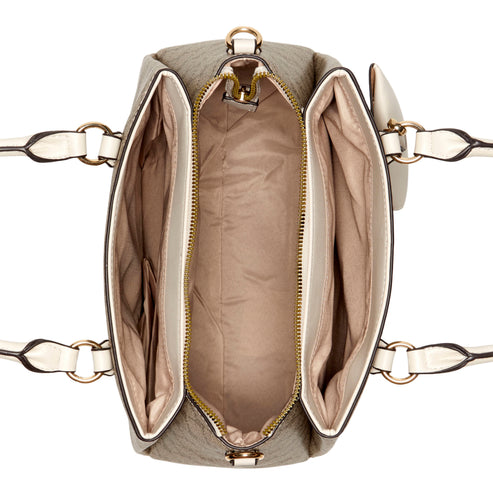 Beige satchel-style handbag with white trim, gold hardware, top-down view.