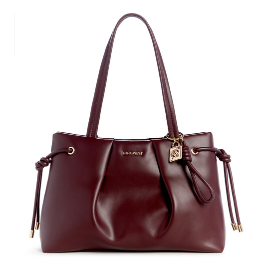 Red tote bag with top handles and lock charm.