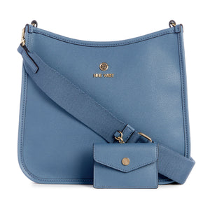 Blue crossbody bag with wide strap and matching coin purse, gold logo at the top center.