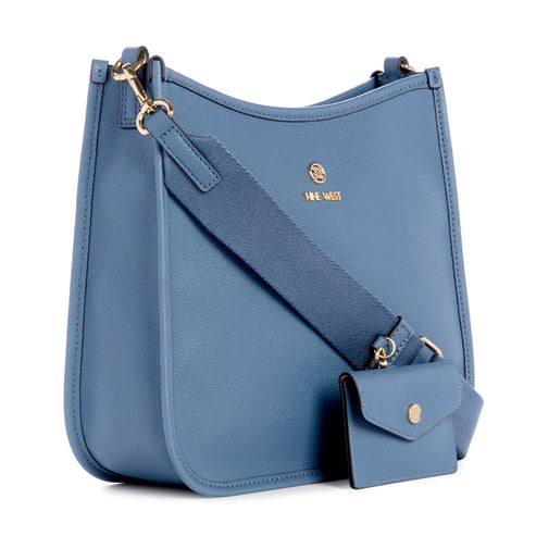 Blue purse with matching wallet and wide strap showing logo on purse.