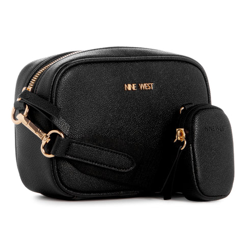 A black, rectangular camera bag with gold hardware and the text NINE WEST in gold lettering. A small black pouch hangs off the side.