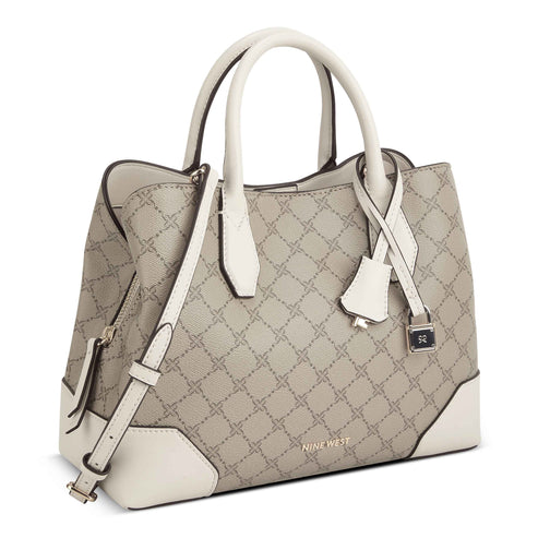 A grey faux-leather handbag with white handles and trim, featuring a repeating stitched pattern of geometric shapes. The brand name "NINE WEST" appears in small letters at the base of the bag.