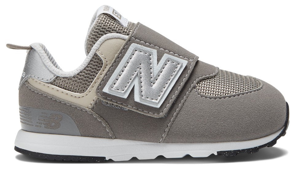 Gray sneaker with velcro strap and large white N symbol