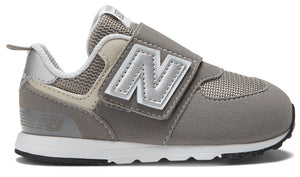 Gray sneaker with velcro strap and large white N symbol