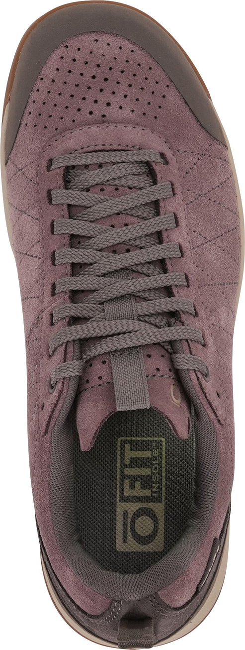 A top-down view of a dusty purple suede sneaker with a perforated toe, diamond-stitched side panels, flat gray laces, and an O FIT insole.