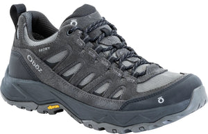 A gray low-top hiking shoe with black accents, laces, a Vibram sole, and the text Oboz and B-DRY visible on the side.
