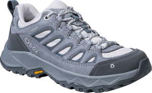 A gray Oboz hiking shoe featuring suede and mesh paneling, a B-Dry waterproof membrane logo on the side, a Vibram rubber outsole, and gray patterned laces.