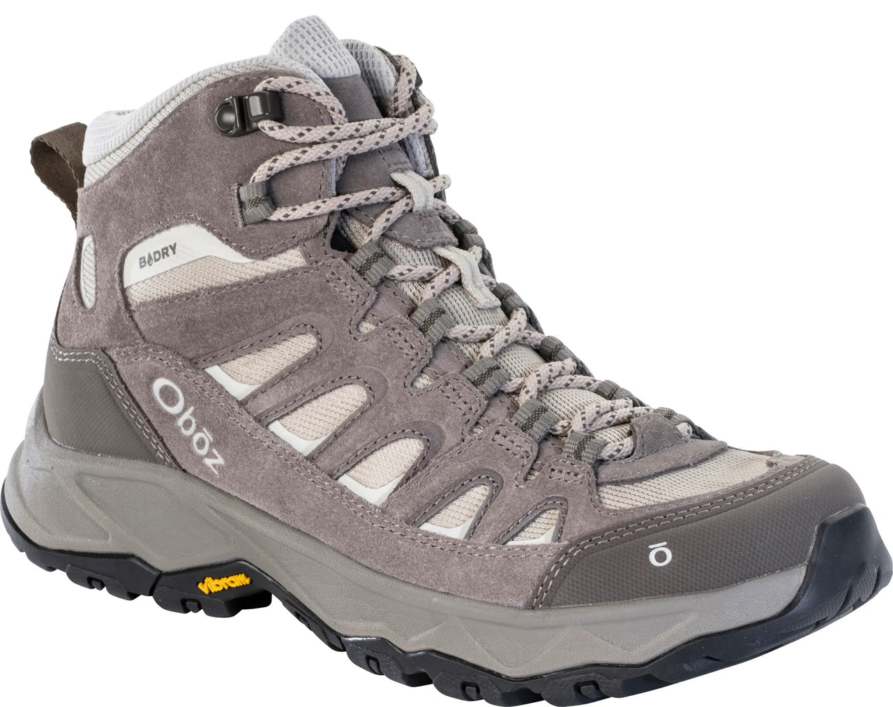 A gray mid-cut hiking boot with mesh panels and suede overlays, featuring a B-DRY label on the ankle, an Oboz logo on the heel, a Vibram logo on the side of the sole, and a black toe bumper.