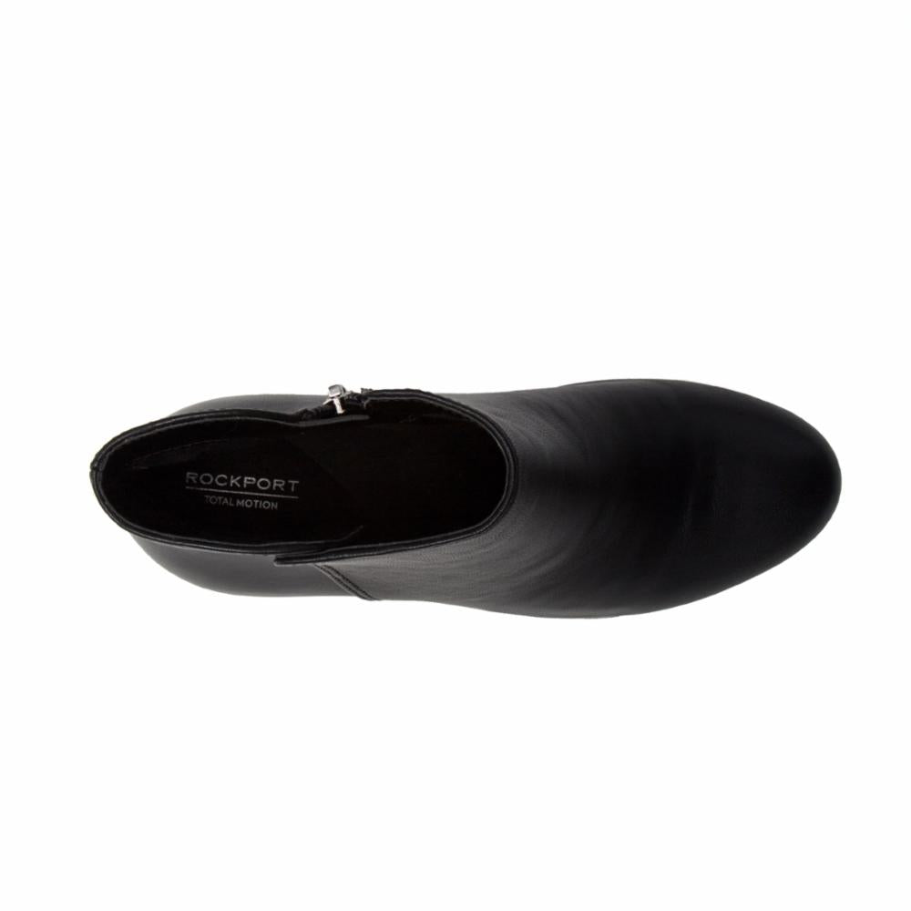 Top-down view of a black leather ankle boot with side zipper and Rockport Total Motion logo.