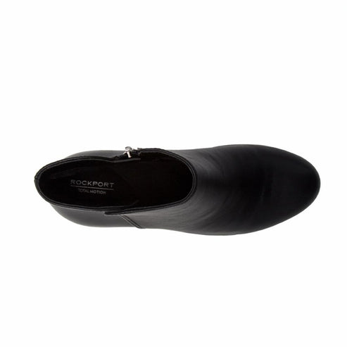 Top-down view of a black leather ankle boot with side zipper and Rockport Total Motion logo.