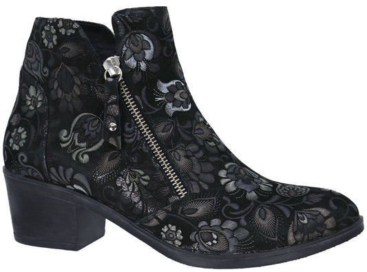 A black ankle boot with a low block heel and an intricate floral pattern in shades of grey and silver, featuring a silver side zipper.