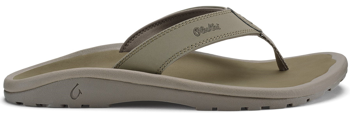 A khaki-colored flip-flop with a toe post.
