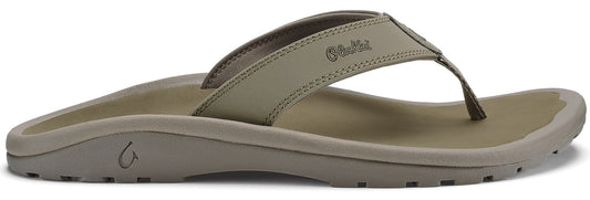A khaki-colored flip-flop with a toe post.