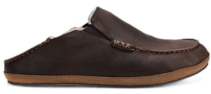 A brown leather slip-on mule shoe with a flat tan rubber sole and visible stitching details along the upper.