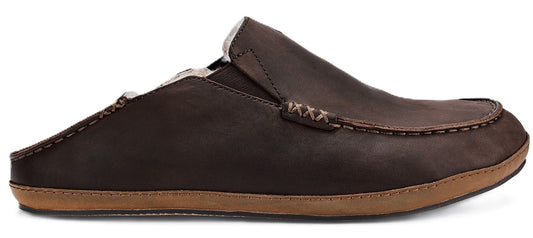 A brown leather slip-on mule shoe with a flat tan rubber sole and visible stitching details along the upper.