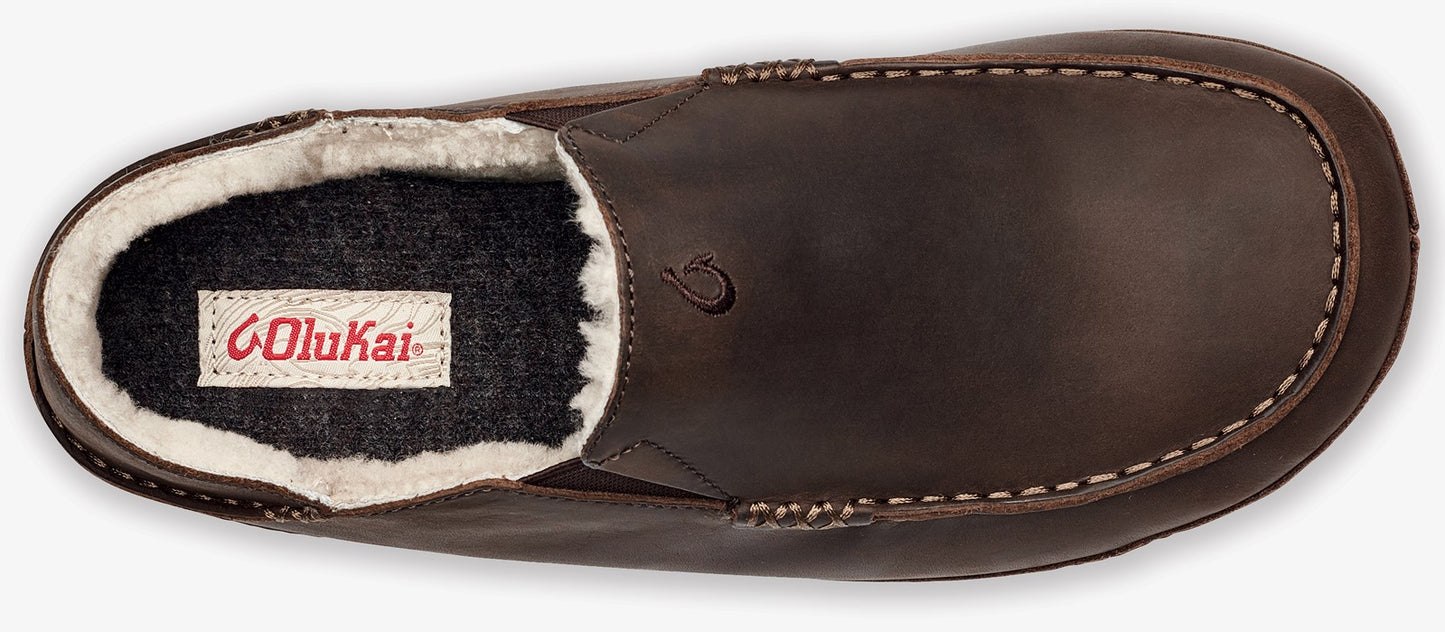 A brown leather slip-on shoe with a cream-colored faux fur lining and a dark grey footbed featuring a white label with the brand name in red text.