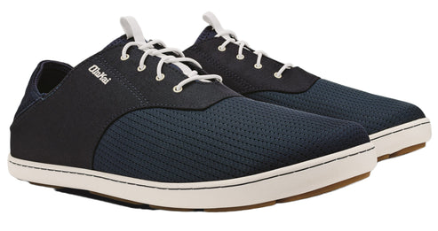 Pair of OluKai men's navy sneakers with white laces and white soles.
