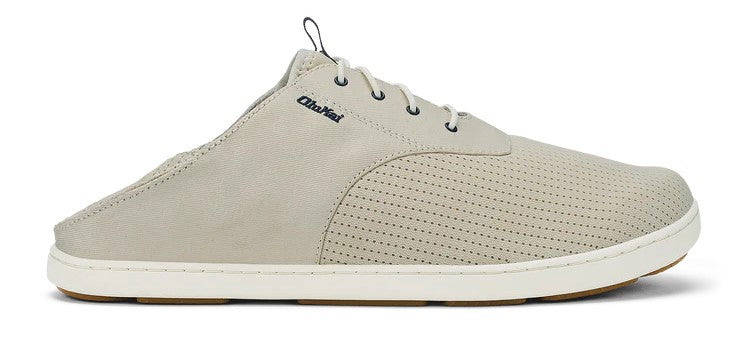 Beige shoe with white sole and small black logo.