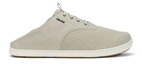 Beige shoe with white sole and small black logo.