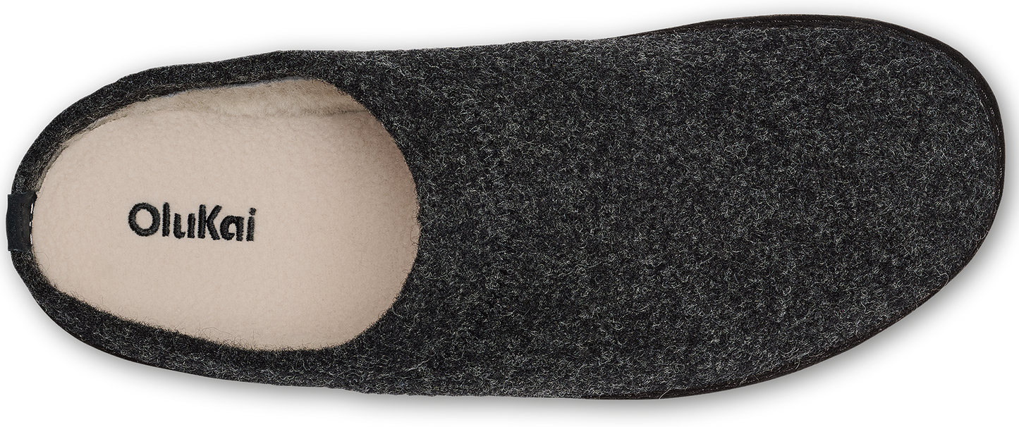 A top-down view of a slipper. The front part of the insole is white and has the brand name Olukai written on it. The rest of the slipper is gray.