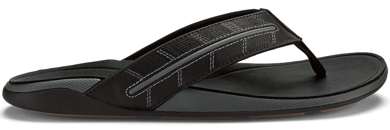 Black sandal with geometric strap.