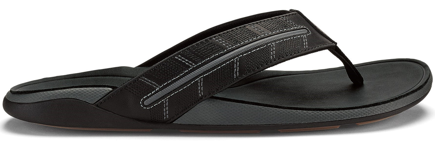 Black sandal with geometric strap.