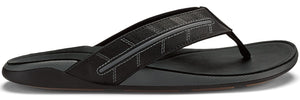 Black sandal with geometric strap.