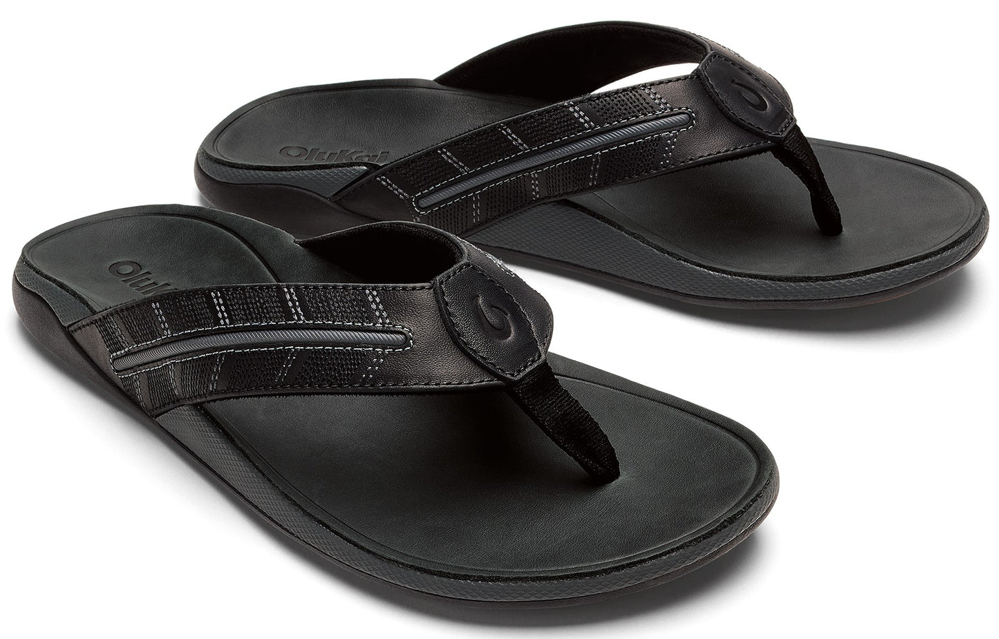 Pair of black flip-flops with textured straps.