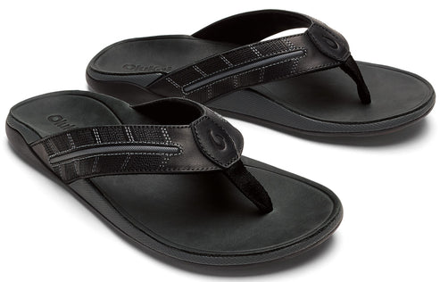 Pair of black flip-flops with textured straps.