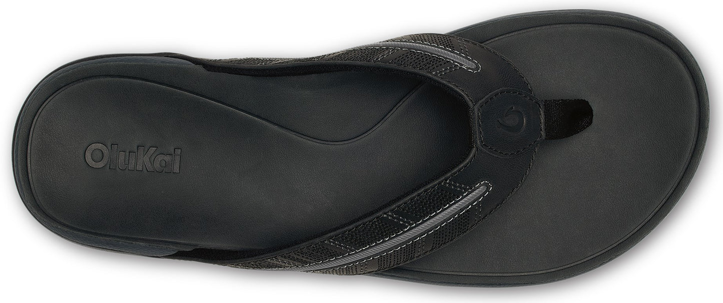 Black flip-flop featuring a textured strap and insole.
