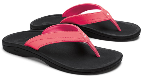 Pair of flip-flops with black sole and pink straps.