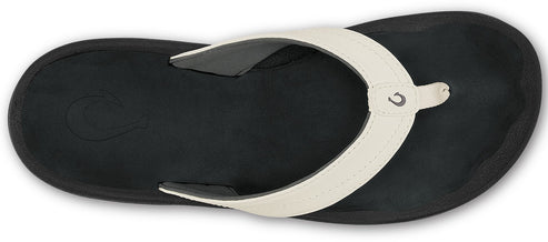 A black flip-flop with a white strap.