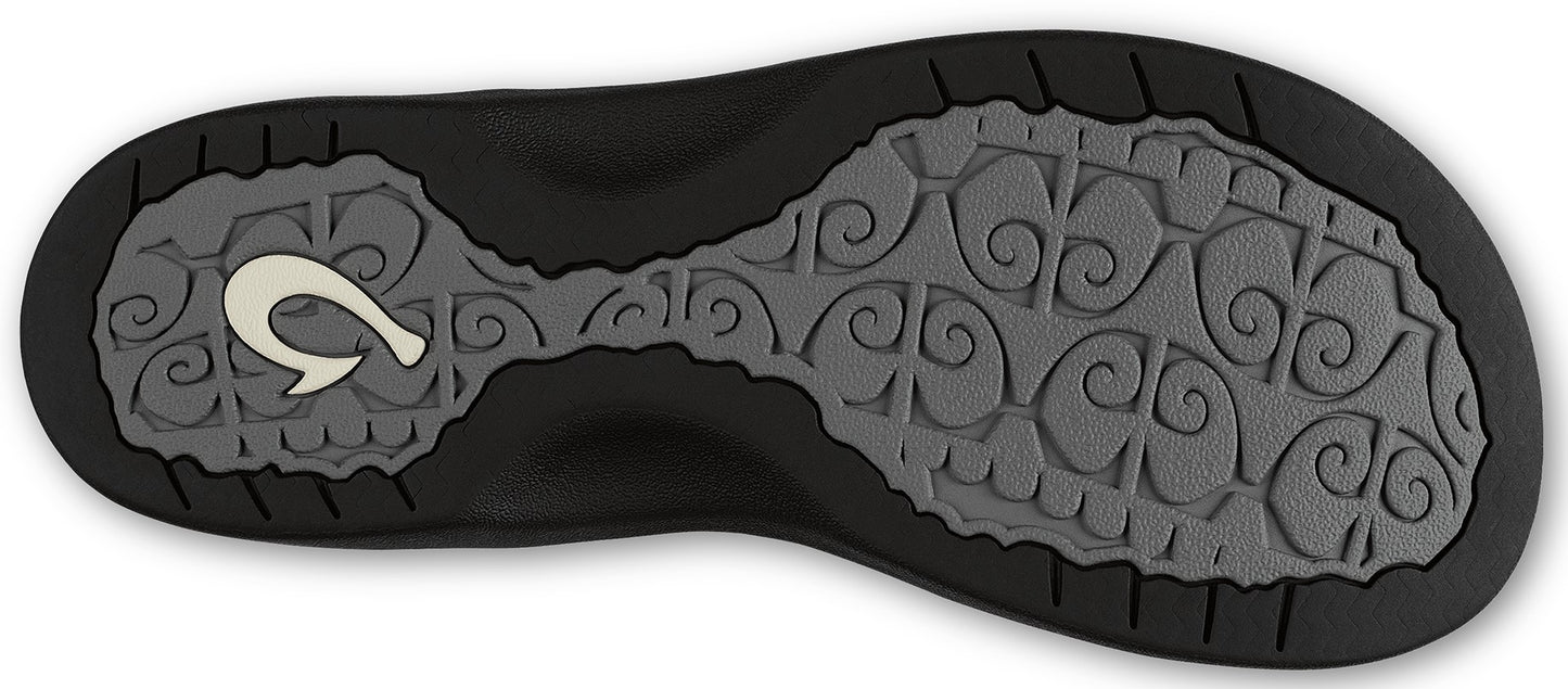 Bottom view of a black sandal with a light gray patterned sole and a white hook logo near the heel.