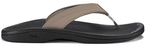 A flip-flop with a taupe strap and a black sole.