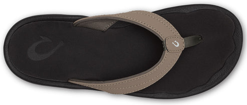 A flip-flop with a gray strap on a black sole.