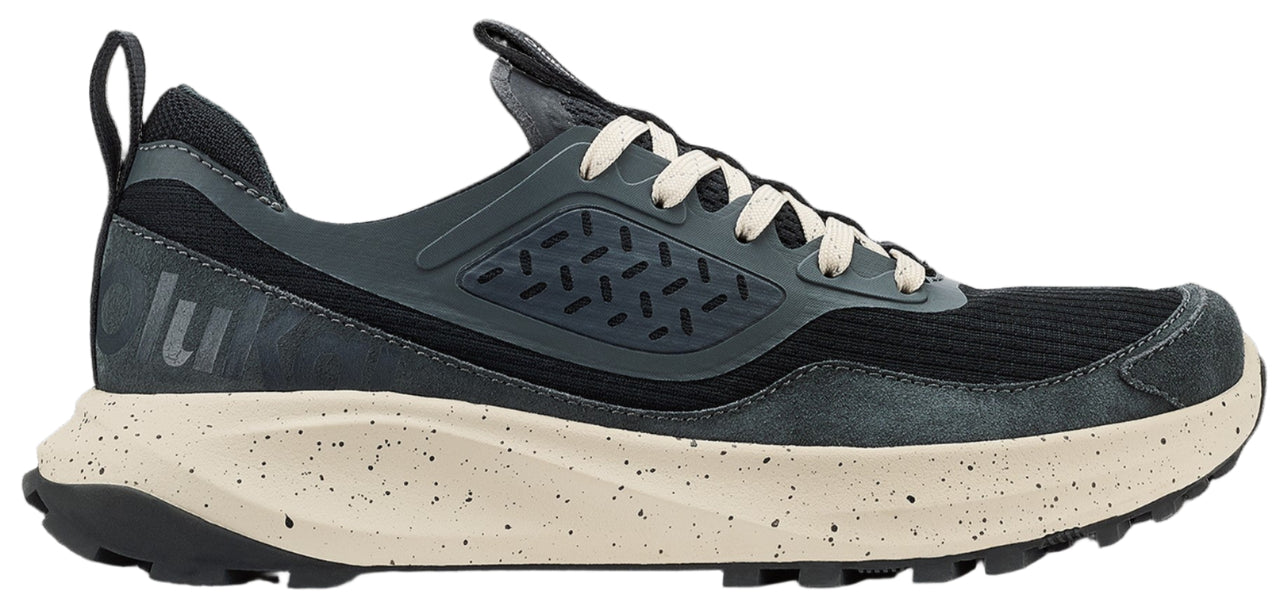 A gray running shoe with white laces and a tan speckled sole.