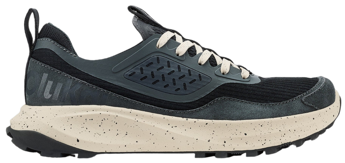 A gray running shoe with white laces and a tan speckled sole.