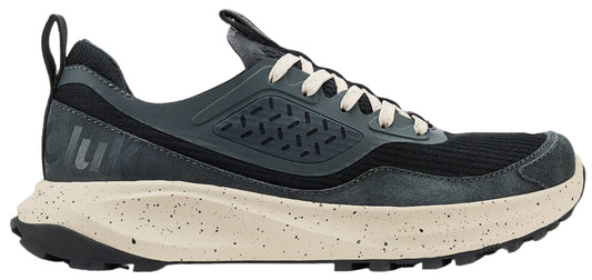 A gray running shoe with white laces and a tan speckled sole.