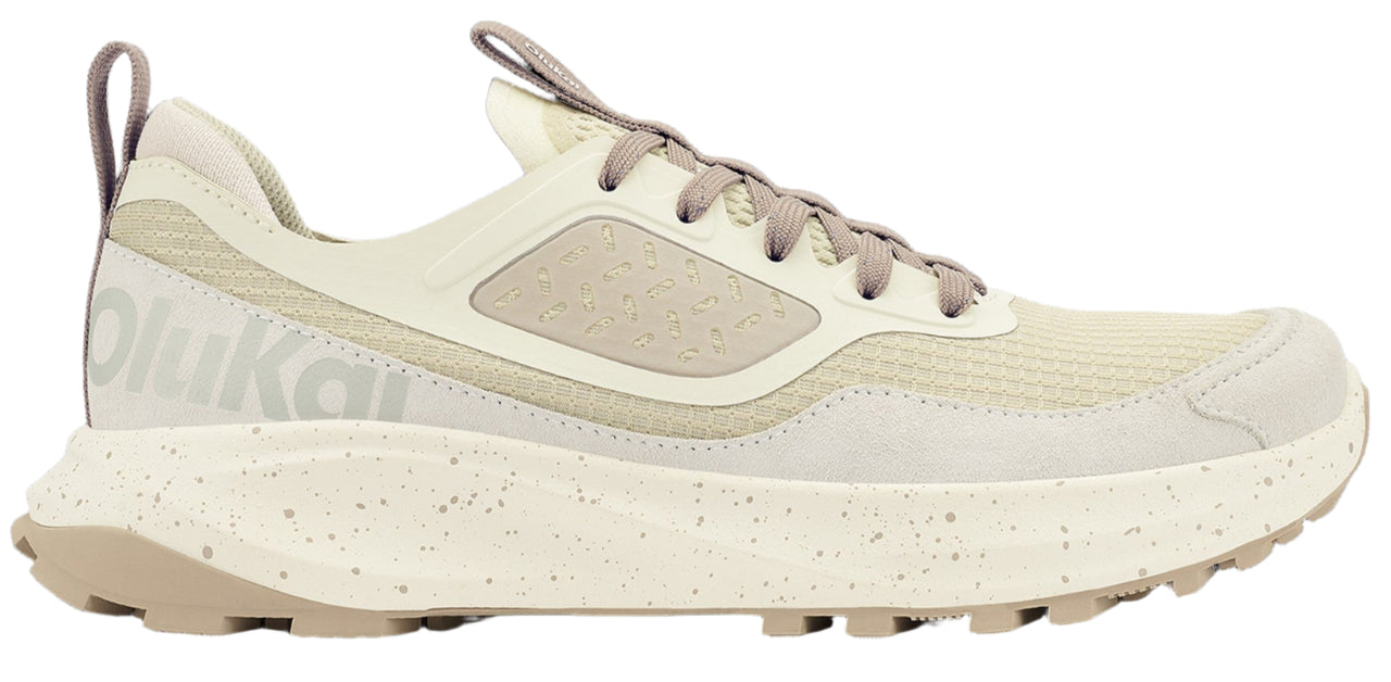 A cream running shoe with beige laces and a speckled sole.