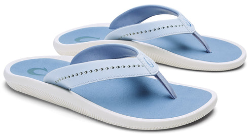 Pair of blue flip-flops with white soles.