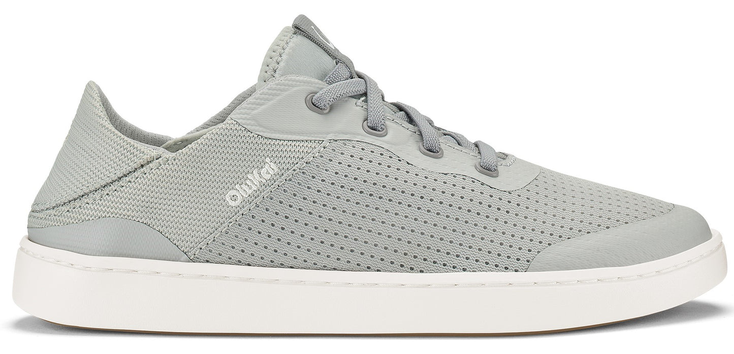 A gray low-top sneaker with white soles and a perforated upper.